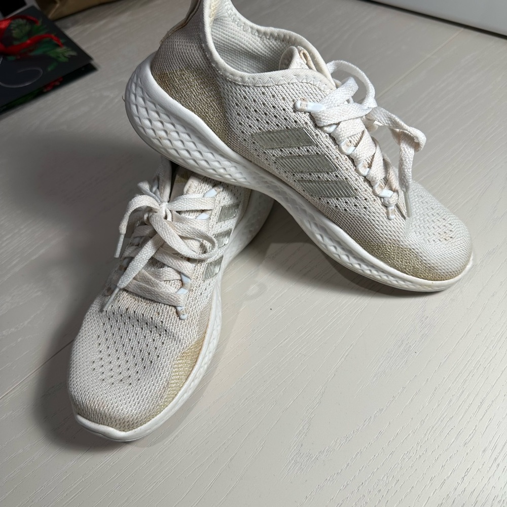 Adidas tan and cream color tennis.